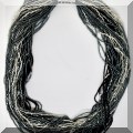 J160. Multi strand seed beaded necklace with silver clasp. - $48 